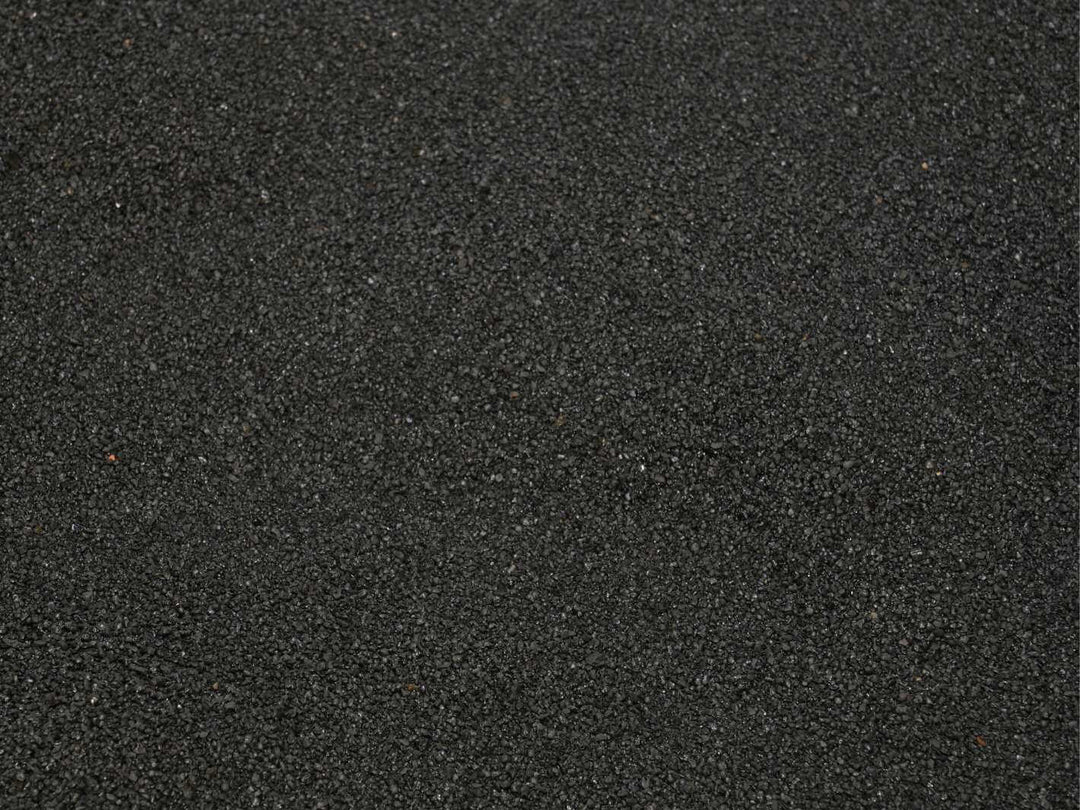 Close up texture of fine black sand 0.1–0.7 mm for terrariums, aquariums and craft projects