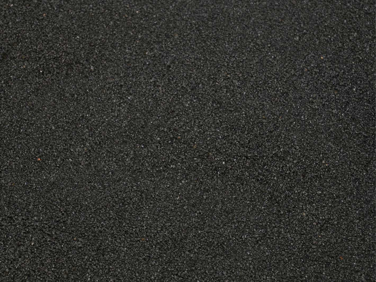 Close up texture of fine black sand 0.1–0.7 mm for terrariums, aquariums and craft projects