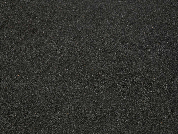 Close up texture of fine black sand 0.1–0.7 mm for terrariums, aquariums and craft projects