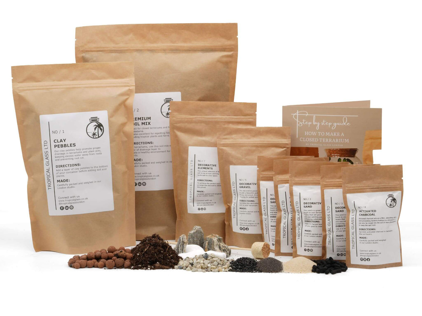 A collection of various packaging materials for a DIY terrarium kit is displayed, including bags labeled for clay pebbles, soil mix, and other essential components.