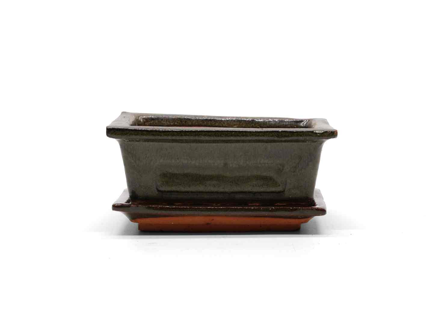 A rectangular decorative pot with a sleek, dark gray finish is displayed atop a matching saucer. The pot features clean lines and a modern design.