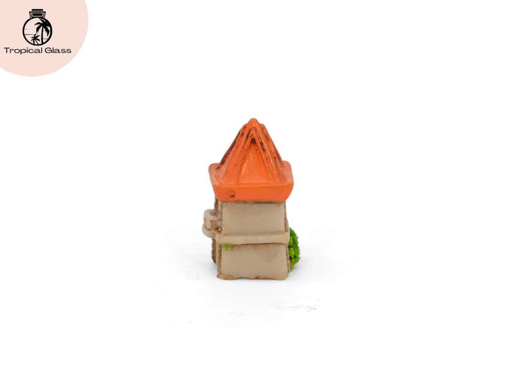 Rear view of the mini castle tower figurine showing textured stone style details