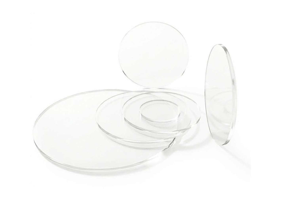 Set of clear acrylic round discs in different sizes used as terrarium lids.