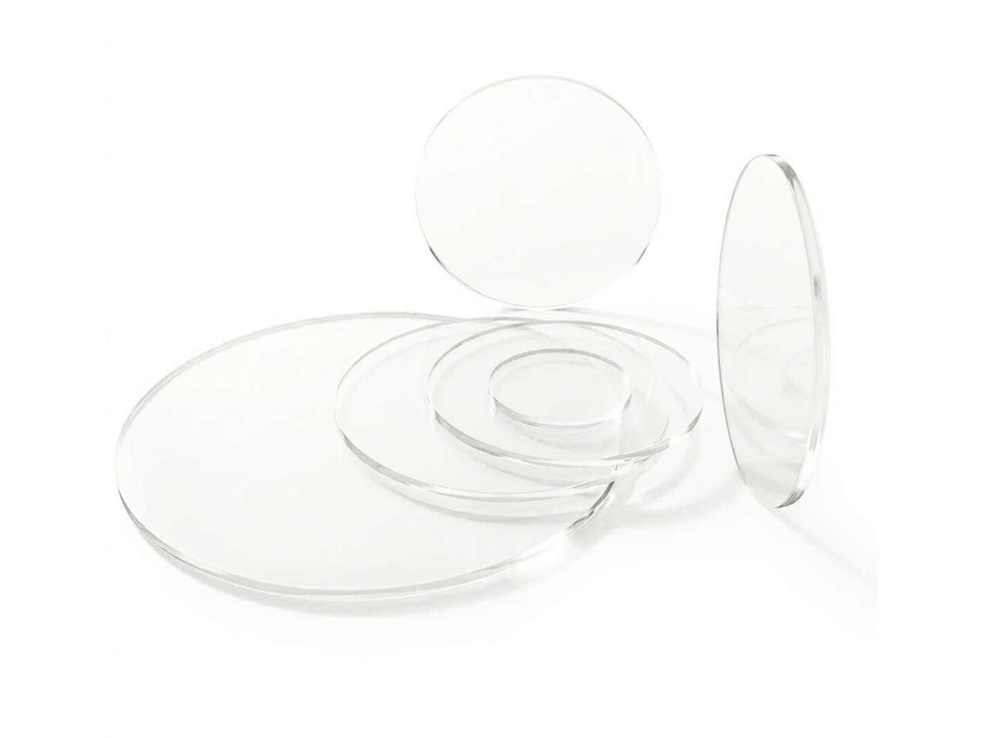 Set of clear acrylic round discs in different sizes used as terrarium lids.