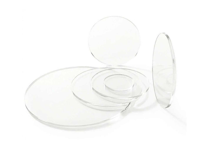 Set of clear acrylic round discs in different sizes used as terrarium lids.