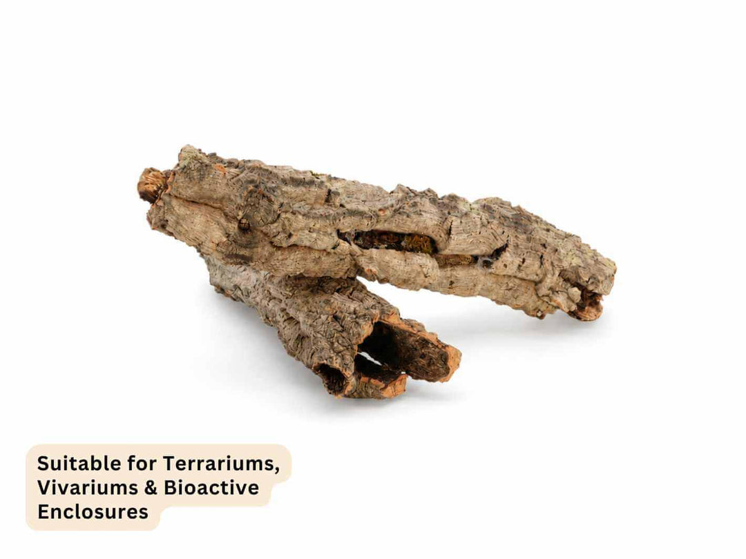 A piece of natural bark or wood prop with rough textured bark, shown on a white background with a text overlay at the bottom left stating &