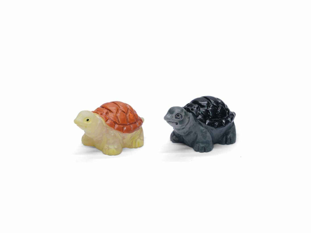 Miniature tortoise figurine for terrariums, available in two colours.