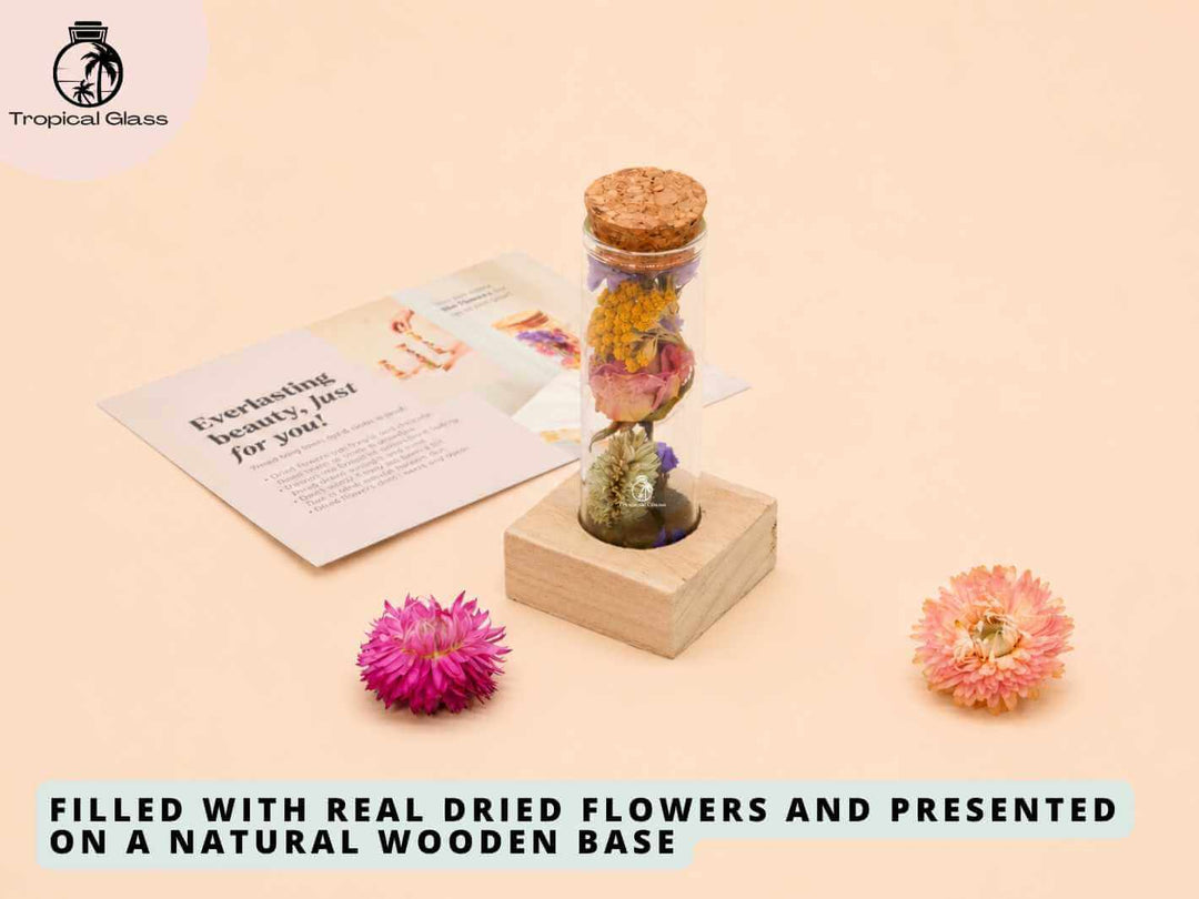 Dried flower bottle display with real dried flowers, cork lid and natural wooden base