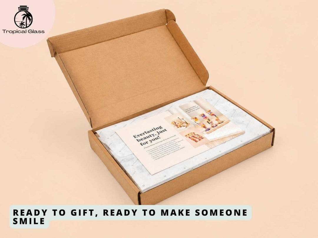 A partially open cardboard gift box reveals a neatly arranged interior with a promotional card and protective paper. The box is designed for gifting, emphasizing its thoughtful presentation and readiness to delight the recipient.