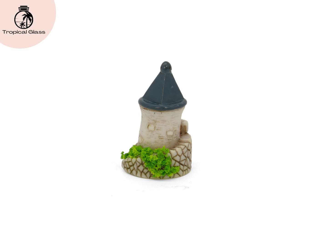Rear view of the mini fairy castle tower figurine showing textured stone style details