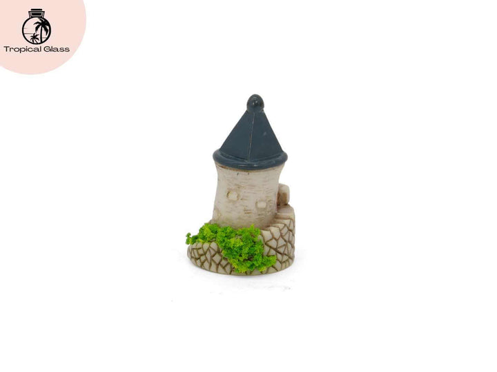 Rear view of the mini fairy castle tower figurine showing textured stone style details
