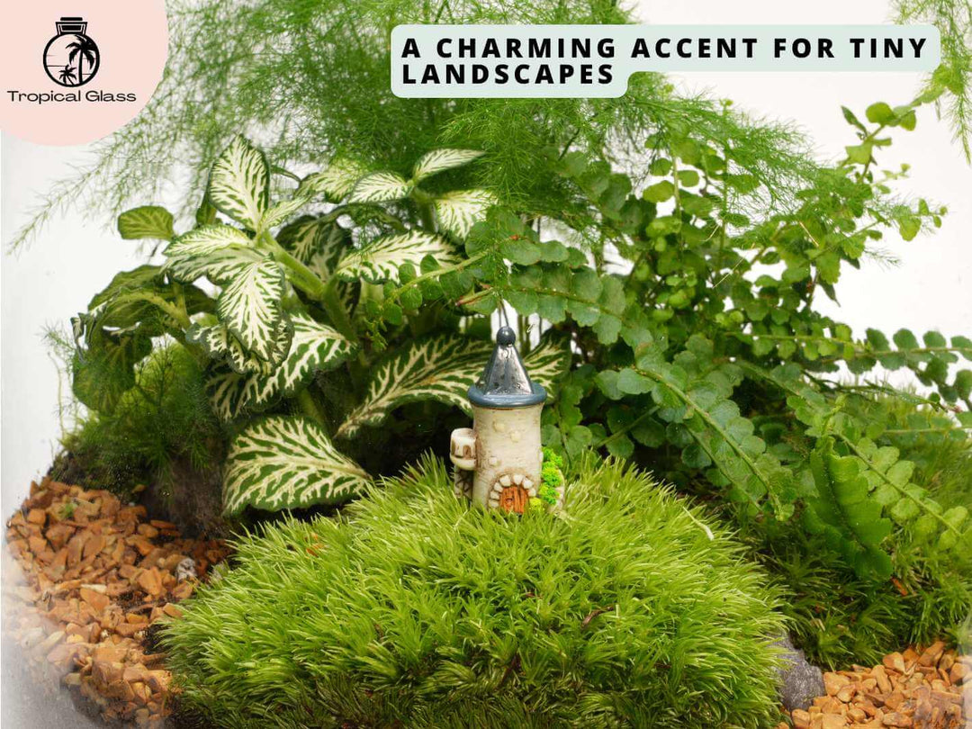 Mini fairy castle tower figurine placed inside a terrarium with moss, gravel and tiny plants