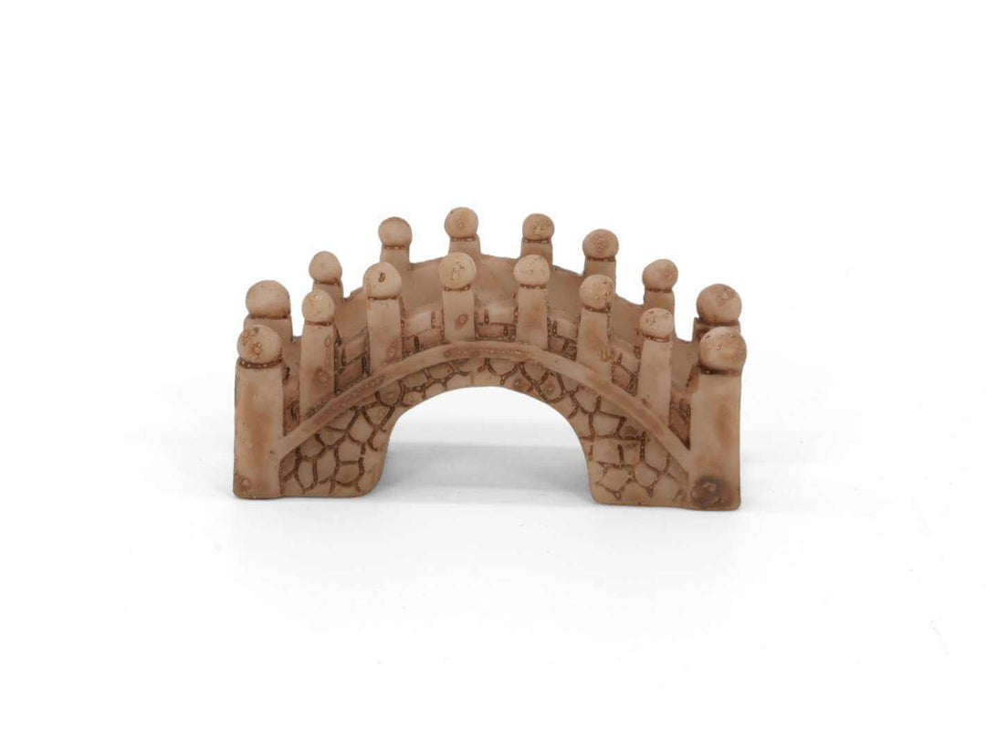 Mini bridge figurine in brown stone effect on white background, miniature scene accessory