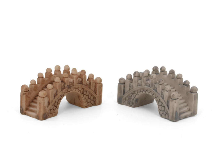 Two miniature arch bridges are displayed side by side, one in a warm brown tone and the other in a cool gray. Each bridge features a textured stone-like finish and decorative rounded pillars along the edges, enhancing their charming appeal.