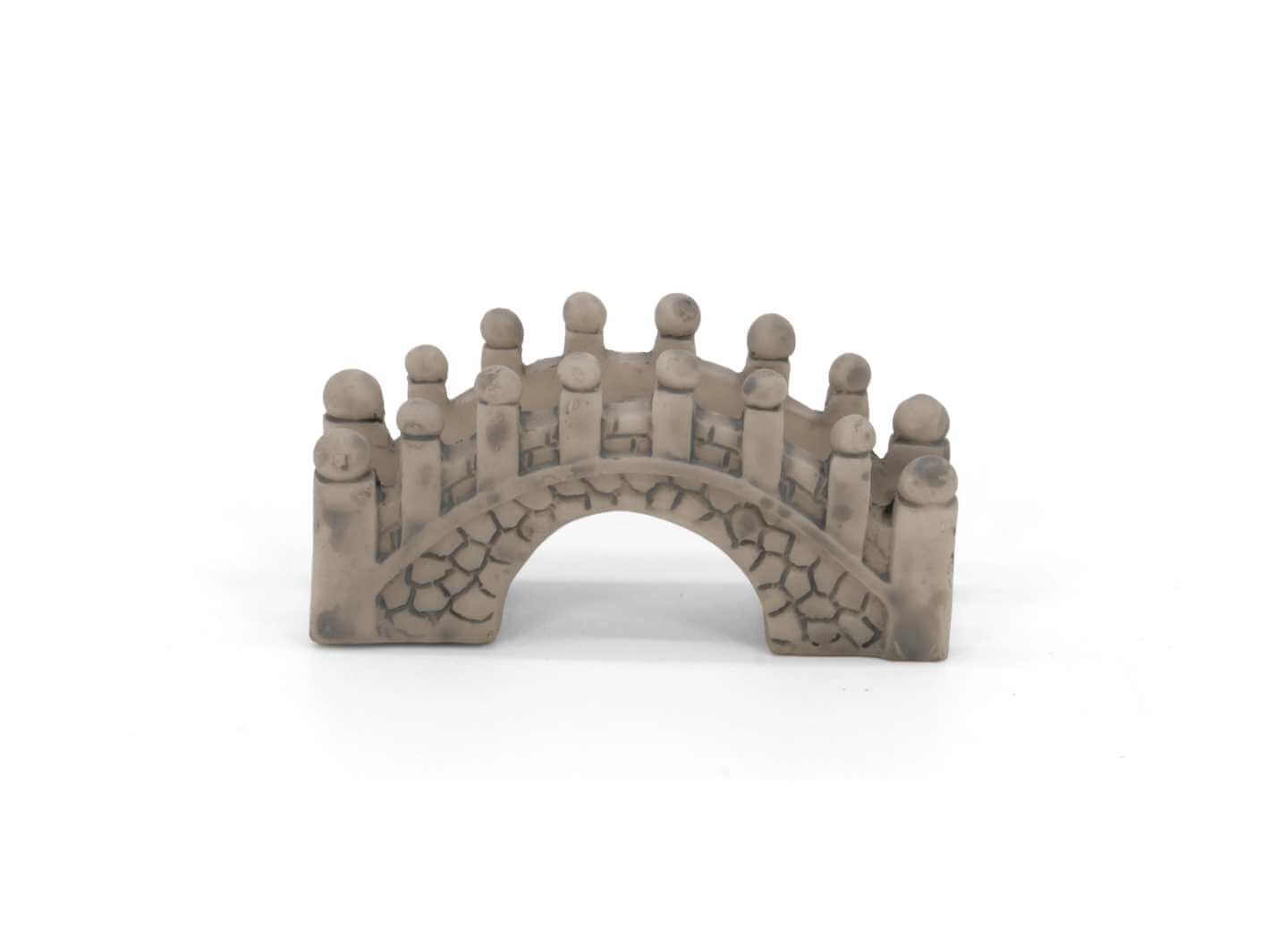 Mini bridge figurine in grey stone effect on white background, terrarium decoration