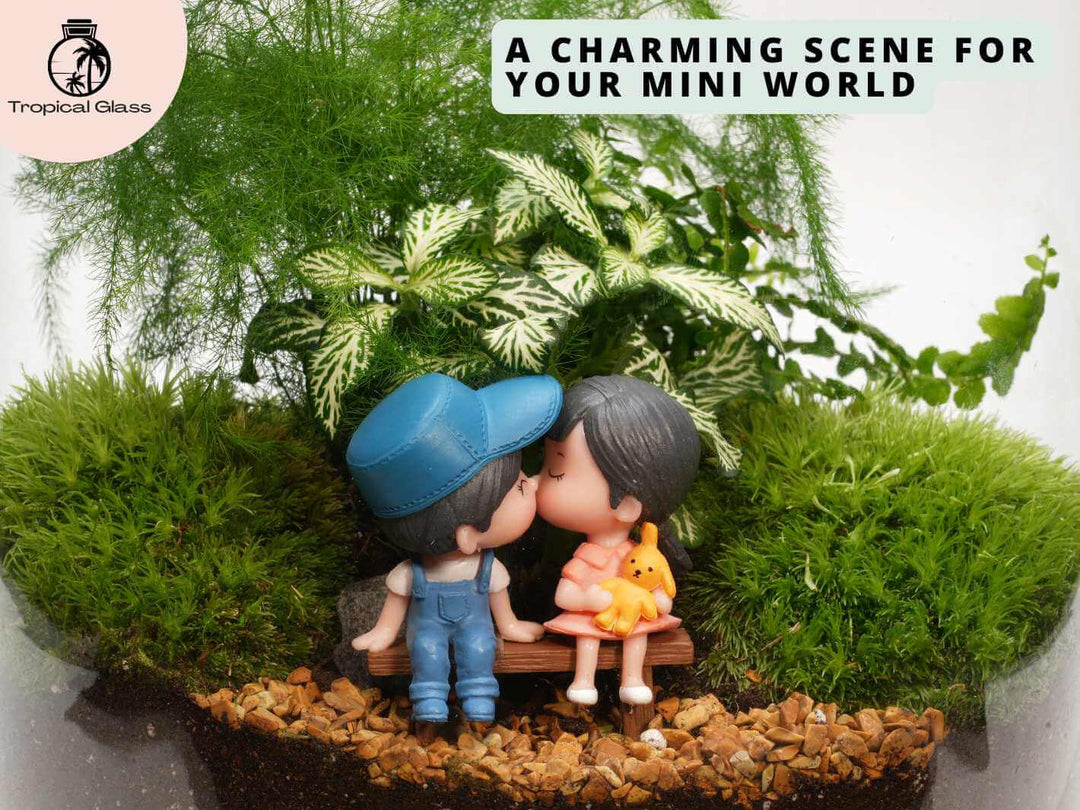Mini couple figurine sitting on bench inside glass terrarium, decorative miniature setup with greenery