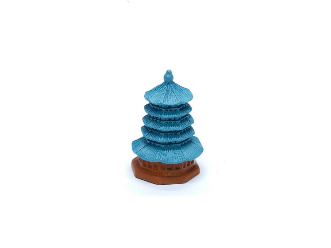 Miniature pagoda with traditional architecture, ideal for Asian-inspired terrarium décor.