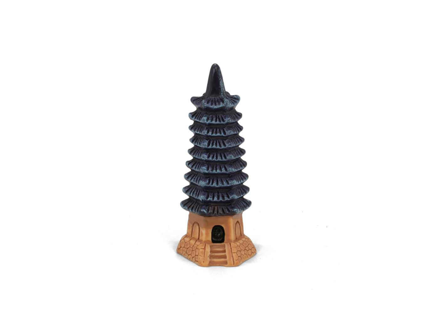 Mini pagoda tower ornament on white background, decorative terrarium accessory