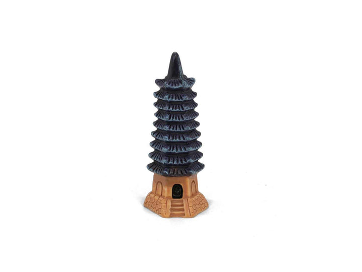 Mini pagoda tower ornament on white background, decorative terrarium accessory