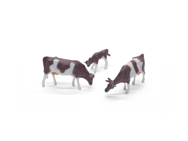 Small cow figurine, ideal for creating a realistic barnyard or countryside scene in miniature setups.