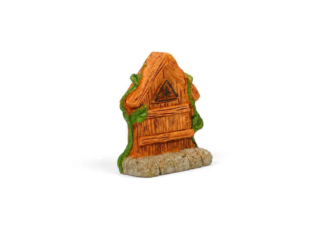 Miniature wooden fairy house for terrarium with green vines and stone base