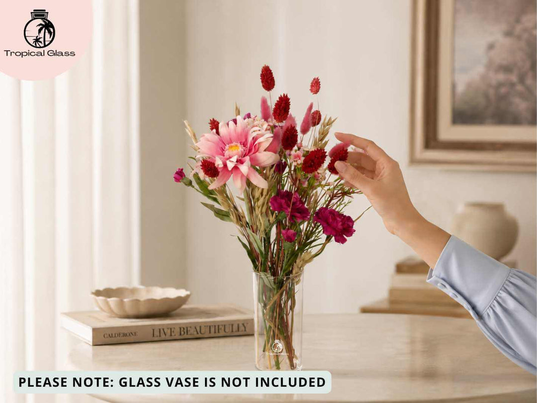 Person appreciating red dried and artificial flowers, a thoughtful floral gift to arrange at home