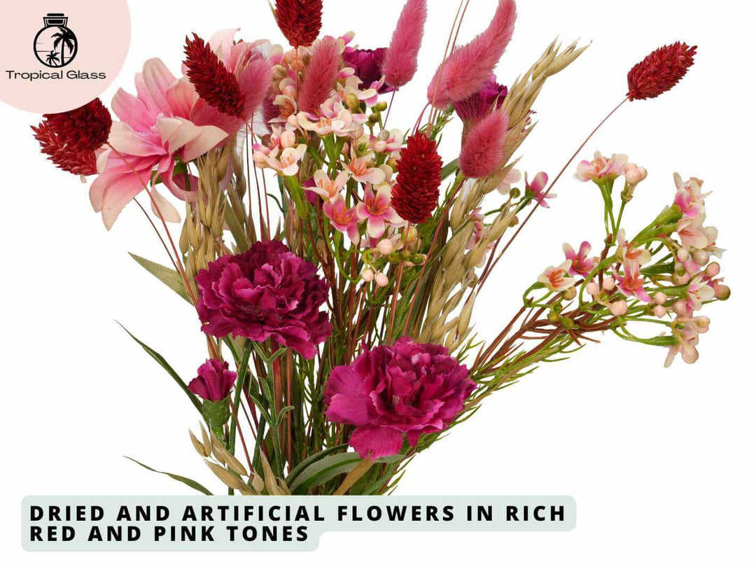 Close up of red and pink dried and artificial flower stems in a letterbox floral gift box