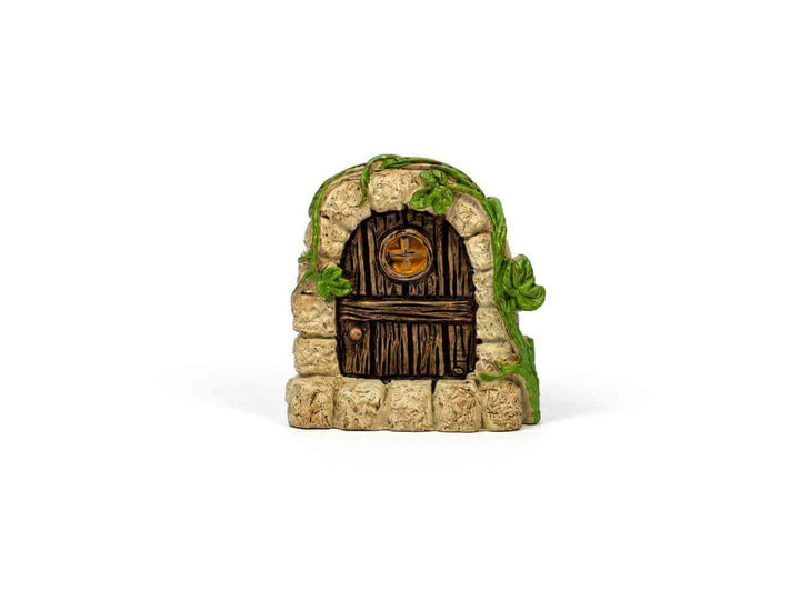 Stone fairy door terrarium ornament with a wooden door and green vines