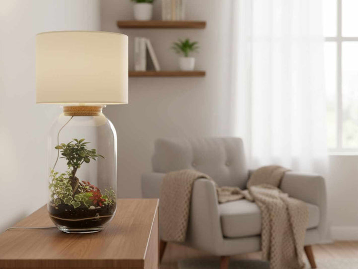 Decorative lamp with a terrarium design on a wooden table in a living room.