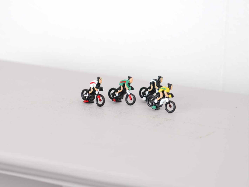 Tiny biker decoration for miniature landscapes, available in various colours, ideal for city and park displays.