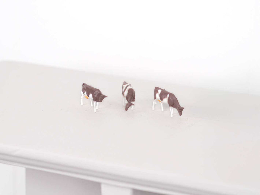 Tiny farm animal decoration for miniature landscapes, fairy gardens, and rural-themed dioramas.