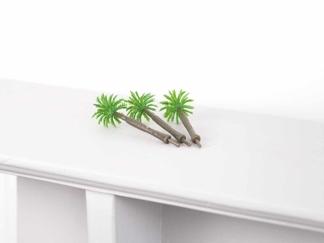 Tiny tropical palm tree decoration for beach, jungle, and island-themed miniature displays.