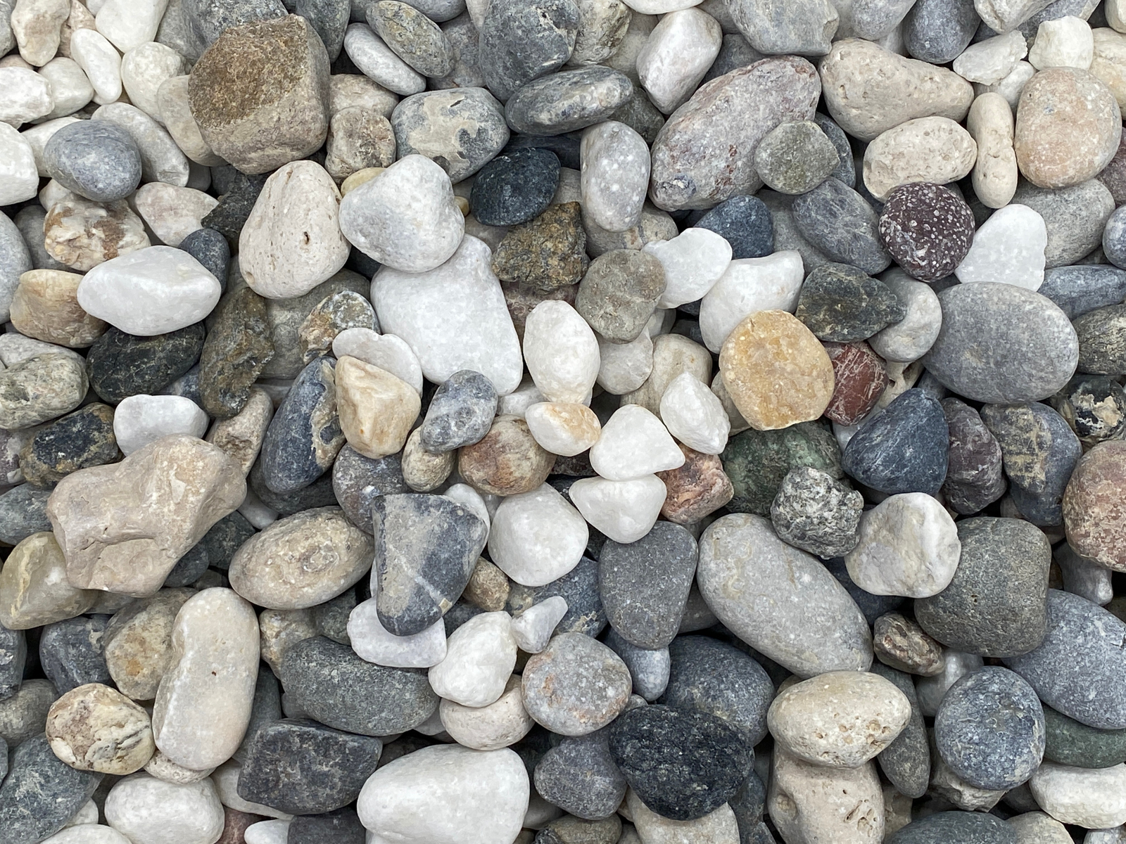 A close up of a bunch of Tropical Glass River Pebbles 20-40mm.